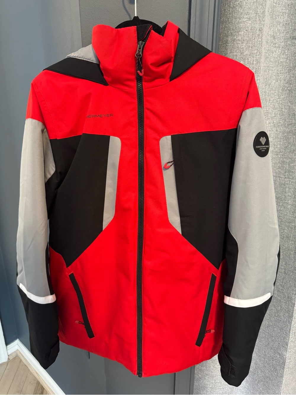 Obermeyer Boys’ Fleet Jacket, color Brakelight, size XL